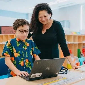 Ww boy with teacher in black